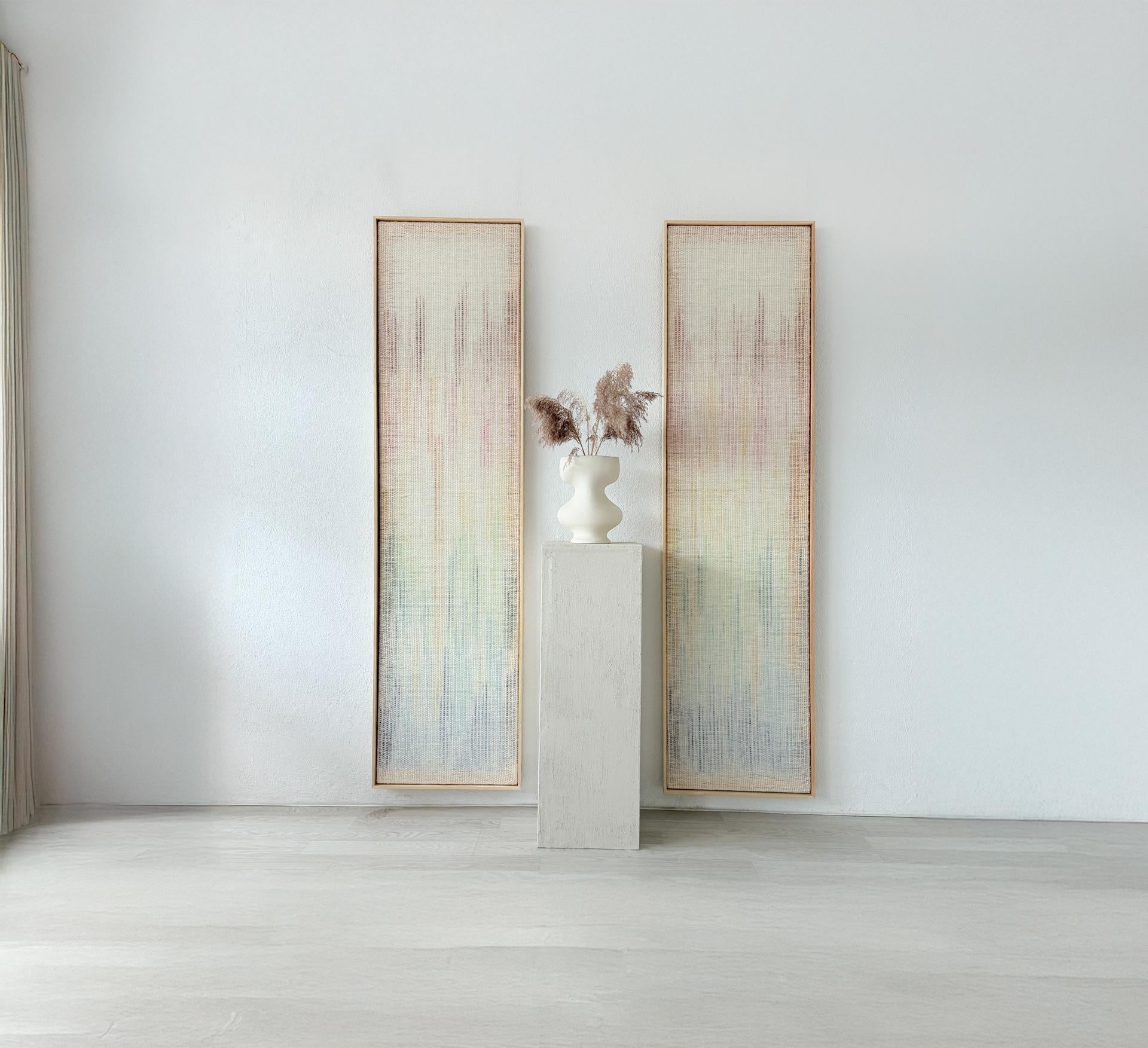 Vitre handwoven wall tapestry set featuring two pieces with a neutral wool base and a soft multicolor gradient in hues of orange, green, blue, and pink. A minimalist and artistic fiber art design perfect for enhancing contemporary or bohemian interiors.